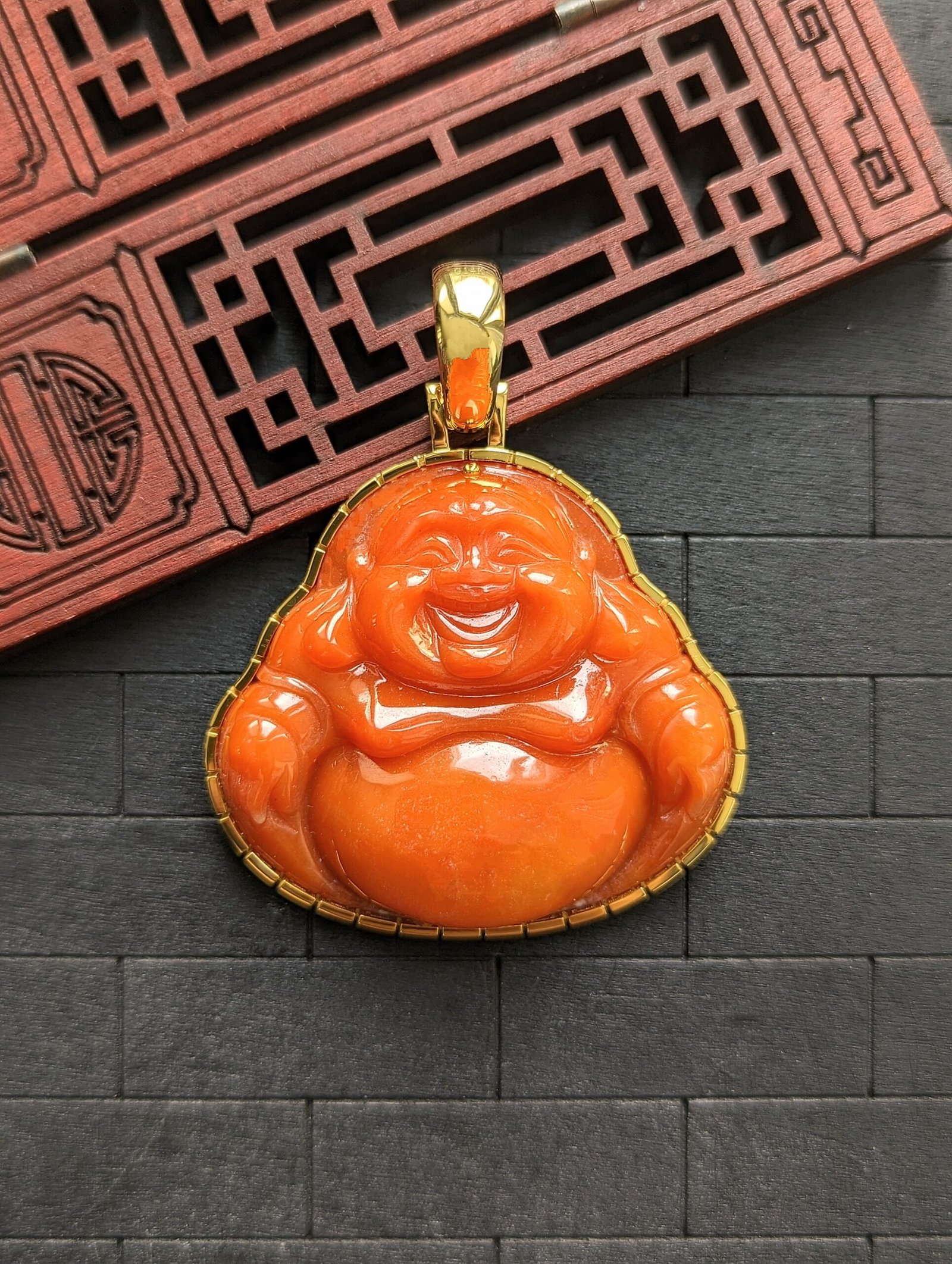 orange buddha pendant